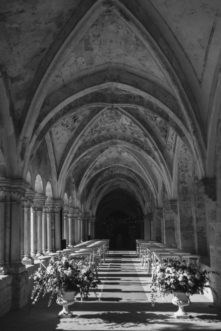Black and white image of the wedding altar located in the lower aisle of a church.